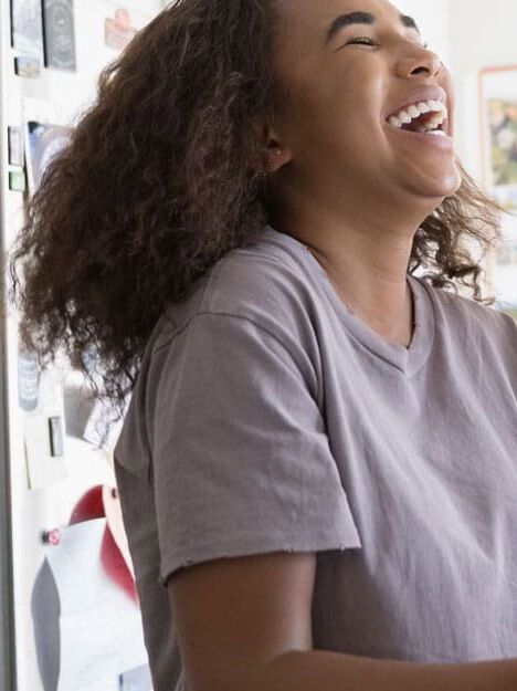 couple laughing in kitchen