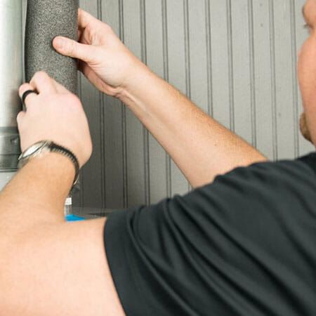 man working on water heater man working on water heater
