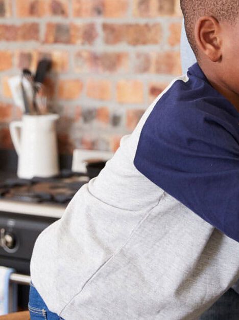 man and child washing food