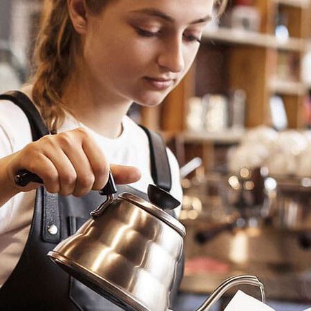 woman pouring coffee