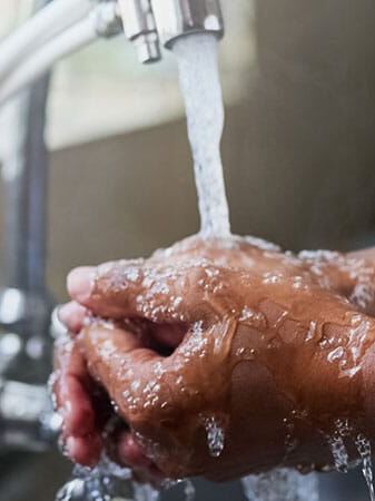 person washing hands