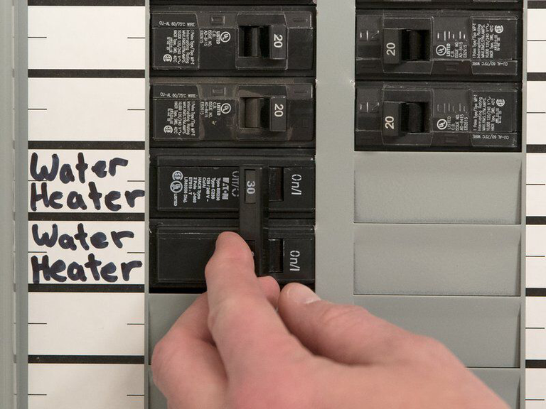 Turn off electricity to the water heater at the breaker
