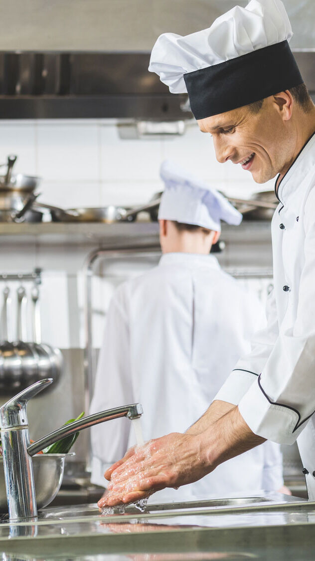 Chefs cooking in a commercial kitchen