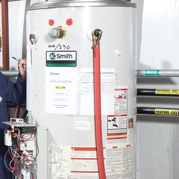 man inspecting water heater