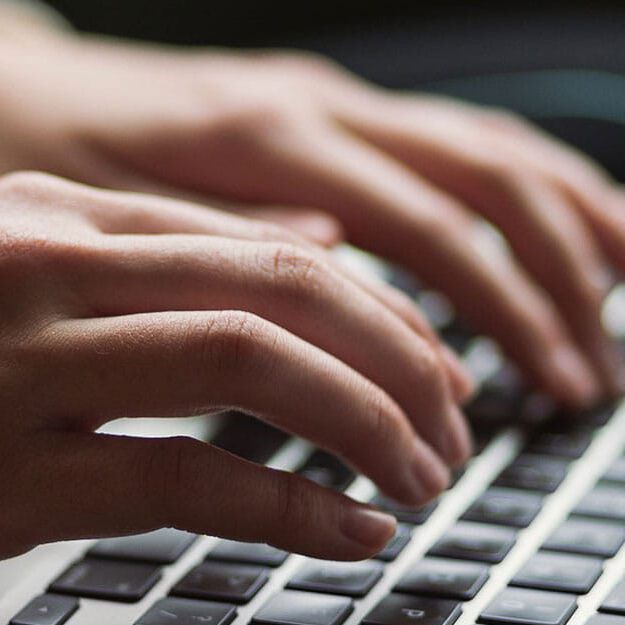 typing on laptop typing on laptop