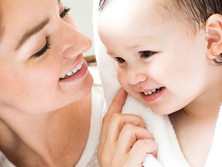 Mother and child smiling