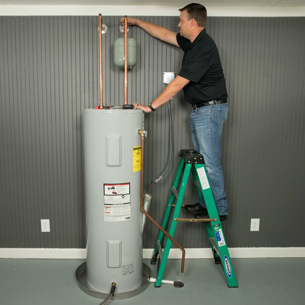 Plumber Installing Thermal Expansion Tank Plumber Installing Thermal Expansion Tank